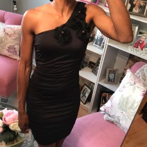 One shoulder black dress with flower detail